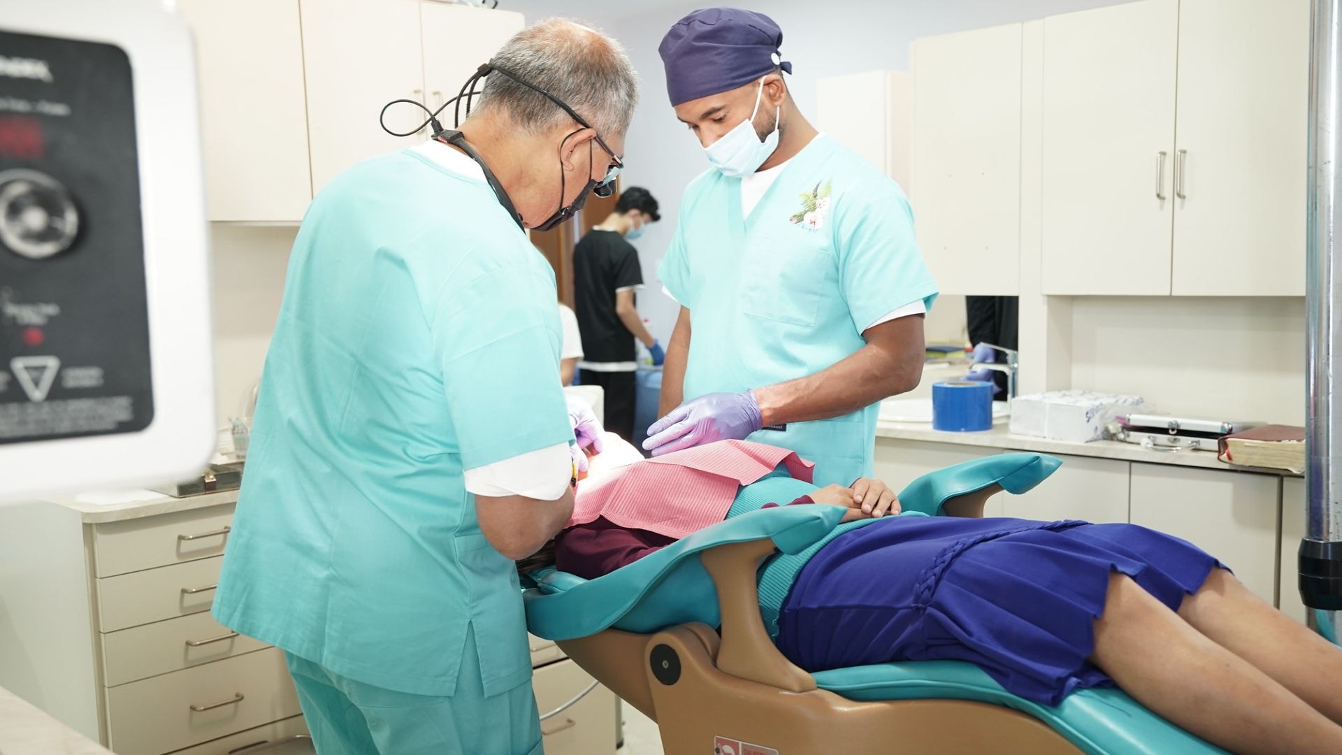 Dentist providing care to a patient in a clinic setting